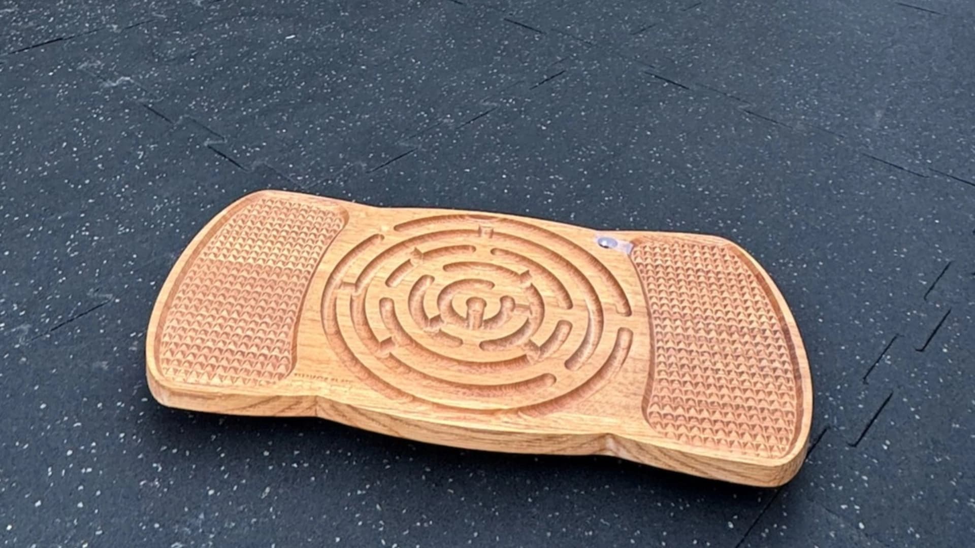 Wooden balance board used in REVO training