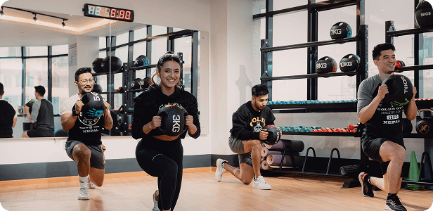 Group class holding kettlebells