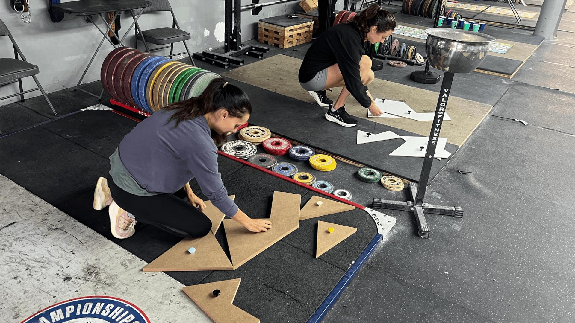 REVO class participants solving a movement puzzle in a gym